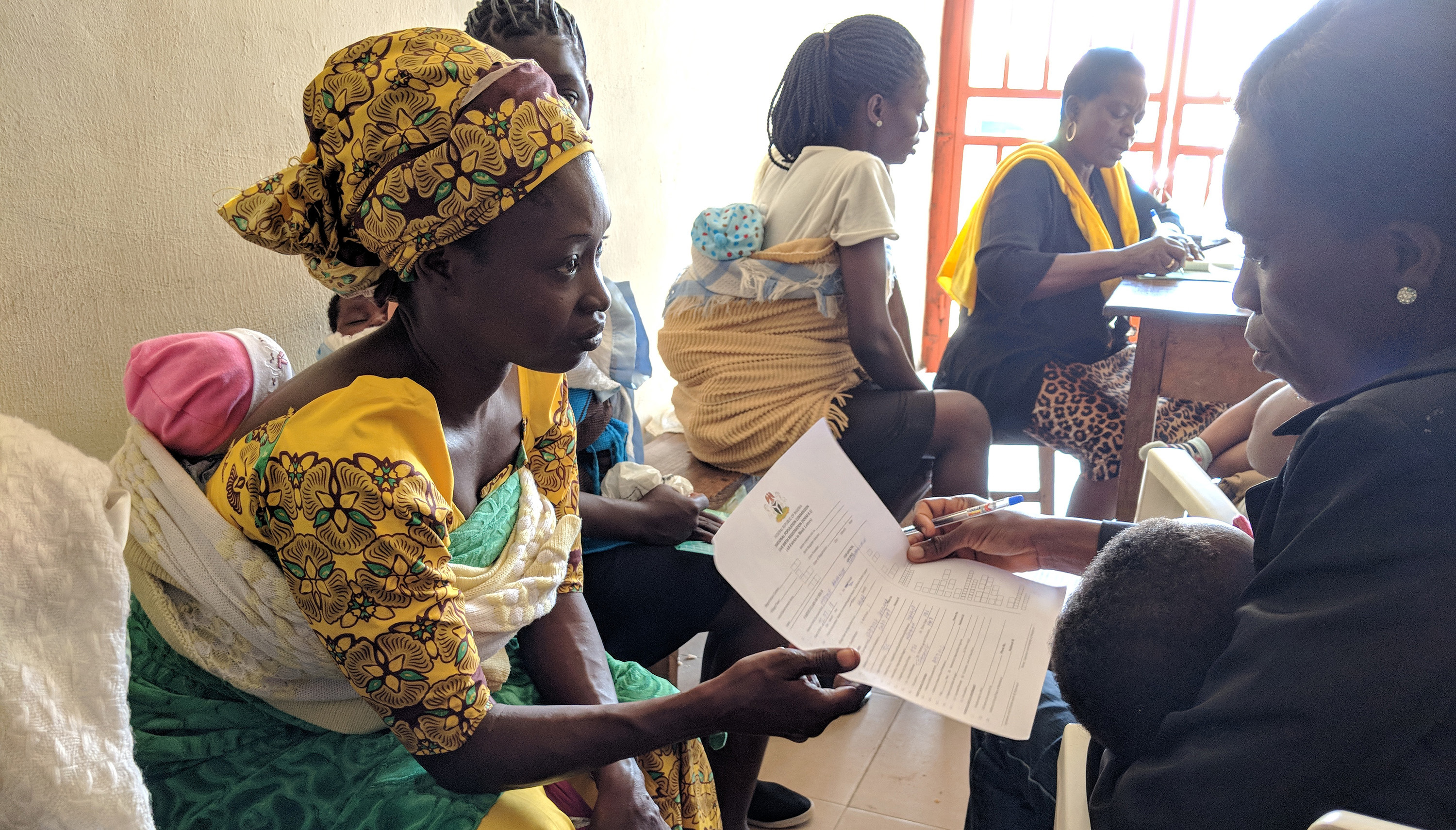 Nigerian woman holding birth certificate