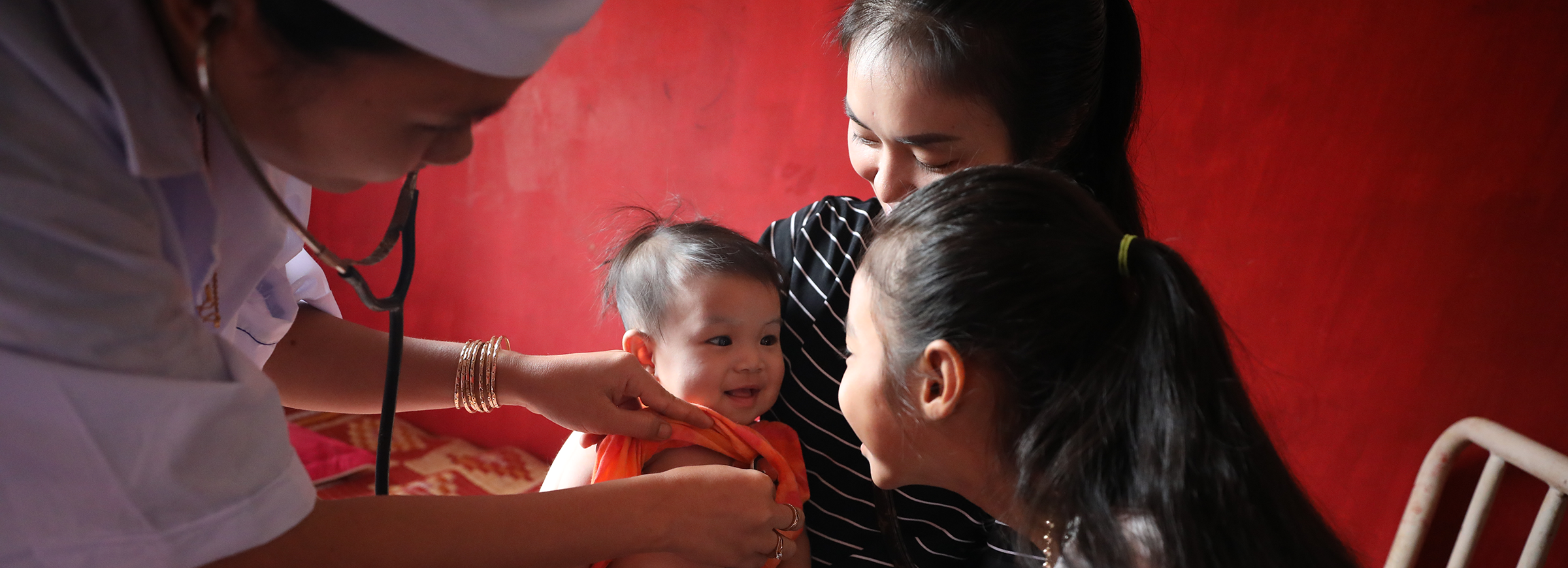 Family at a health center in Cambodia. Dominic Chavez/GFF