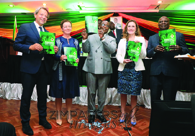 Vice President and Minister of Health and Child Care Dr Constantino Chiwenga is joined by European Union Ambassador to Zimbabwe Jobst Von Kirchmann (left), Irish Ambassador to Zimbabwe Fionnuala Gilsenan (second from left), United Kingdom Ambassador to Zimbabwe Melanie Robinson (second from right) and United Nations Resident Coordinator Edward Kallon (right) in launching the National Health Investment case strategy book in Harare — Picture: Kudakwashe Hunda.