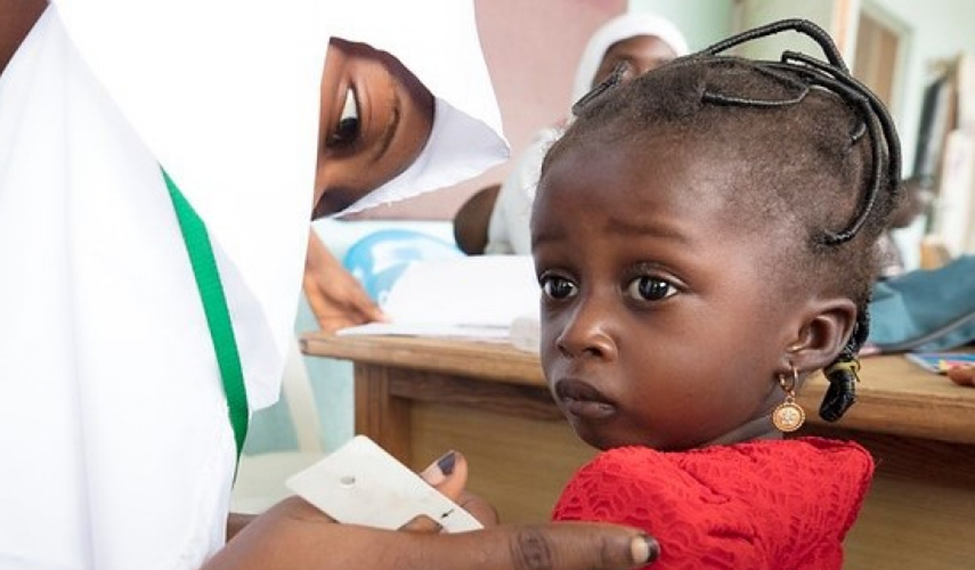 Children's growth-monitoring is checked at the Airport Clinic in Minna, Nigeria. Photo © Dominic Chavez/The Global Financing Facility