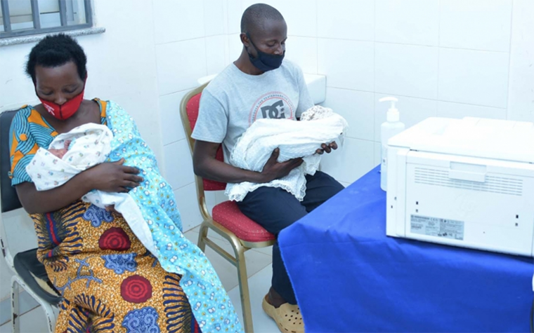 A mother with a health official completing birth registration for her twin babies at Masaka District Hospital, Kigali, Rwanda. Photo credit: Annette Umugwaneza/ Rwanda’s National Identification Agency